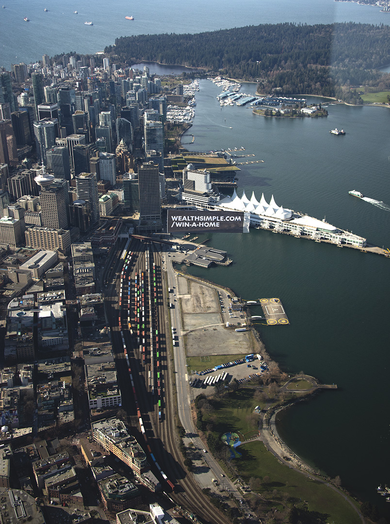Wealthsimple — aerial Vancouver harbour billboard